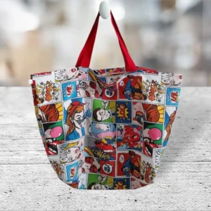 grand sac cabas. Motifs bandes dessinées colorées avec les anses rouges.